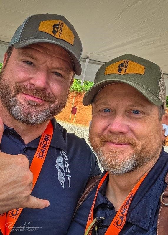 Ronin Arms team members taking a selfie at a cancon event
